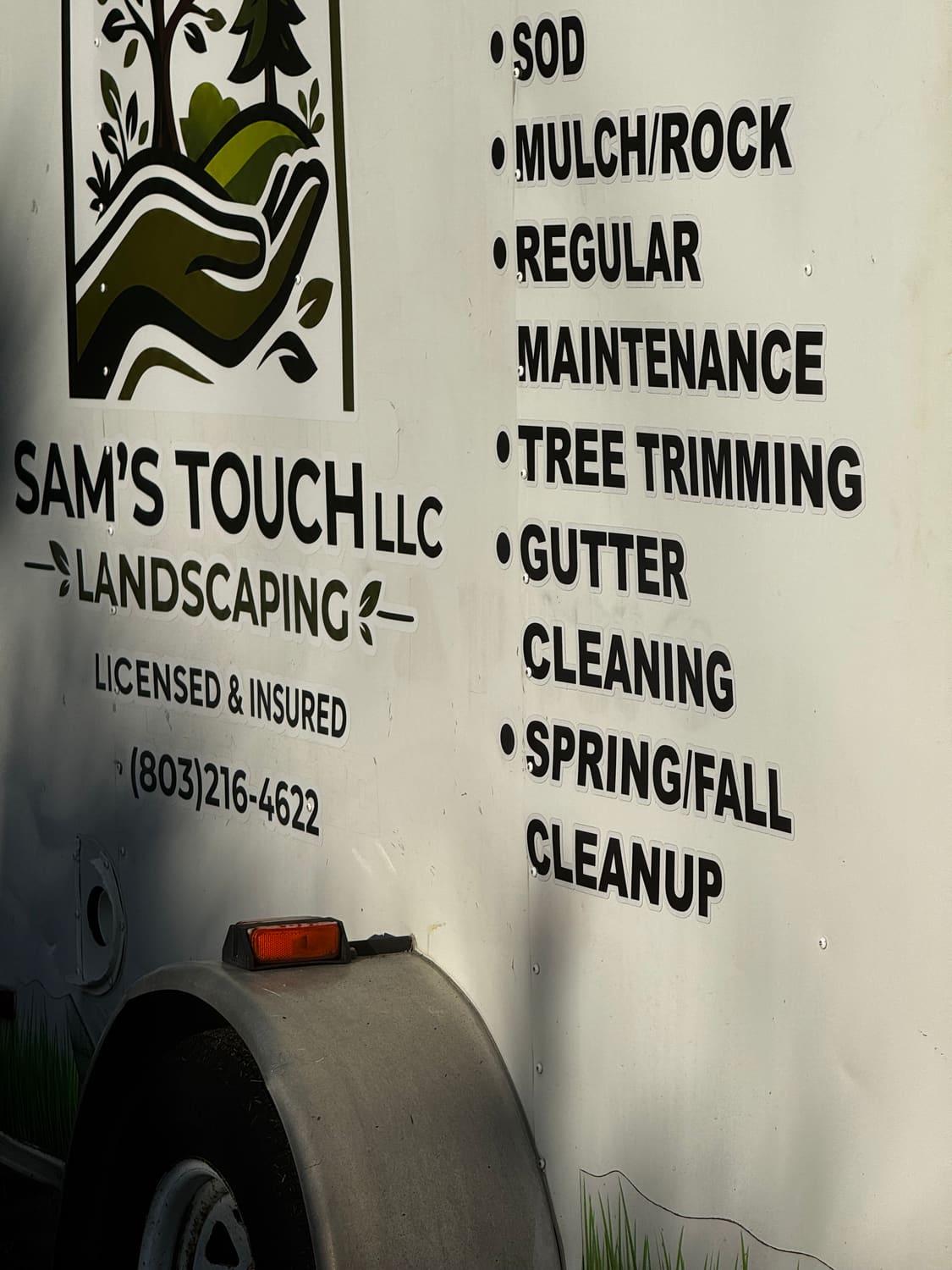 Sam's Touch Landscaping service list on the trailer